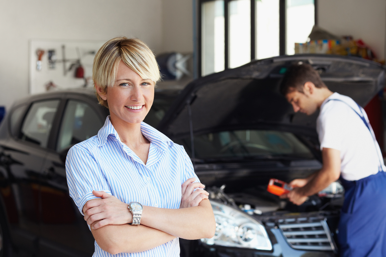 Woman Posing in Front of a Repair Man